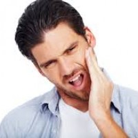 Man suffering with jaw pain