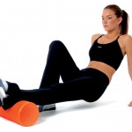 Lady using foam roller on calf