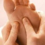 Reflexology treatment on foot